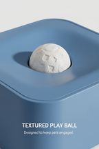 Close-up of the textured white play ball in the blue pet toy